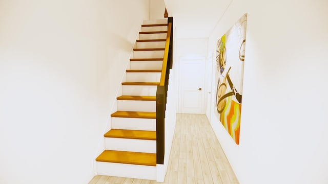 stairs featuring hardwood / wood-style floors