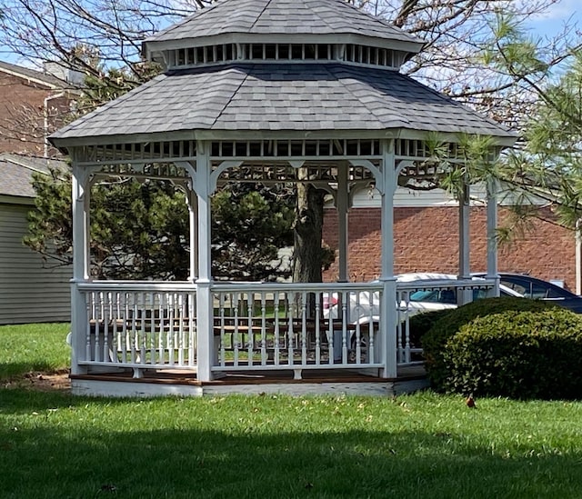 back of house with a gazebo