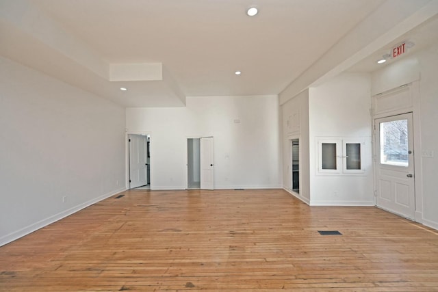 unfurnished living room with light hardwood / wood-style flooring