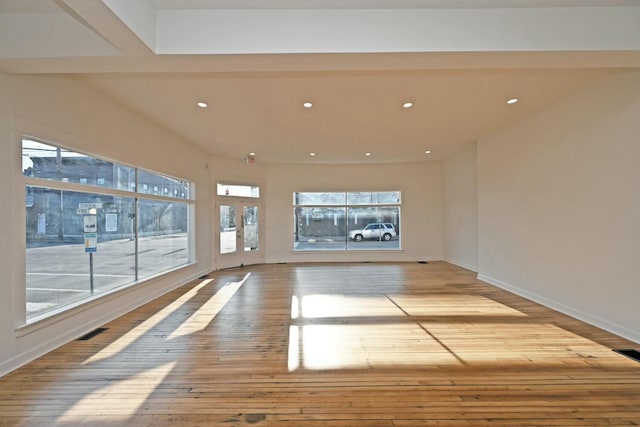 unfurnished room with light wood-type flooring