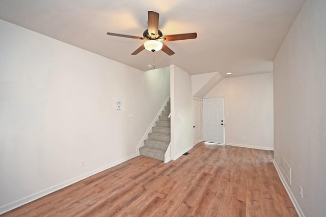 unfurnished living room with ceiling fan and light wood-type flooring