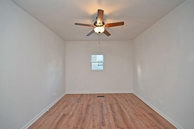 unfurnished room featuring ceiling fan and light wood-type flooring