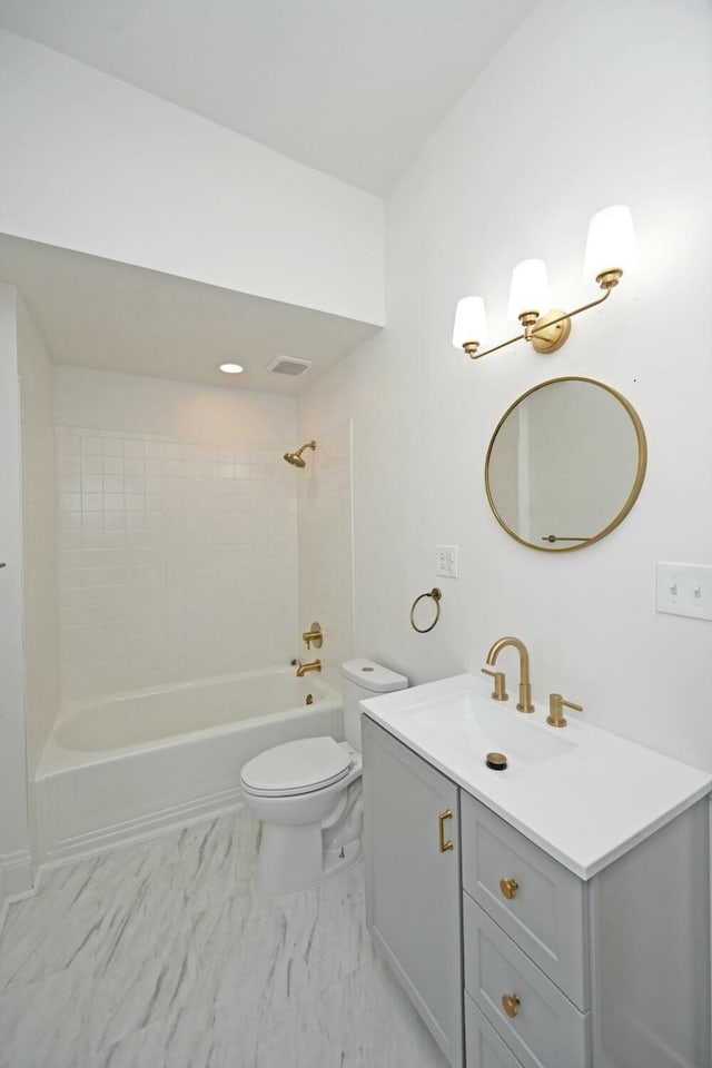 full bathroom featuring vanity, toilet, and tiled shower / bath combo