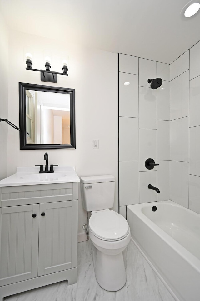 full bathroom with vanity, toilet, and tiled shower / bath