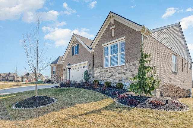 view of front of house with a garage and a front yard