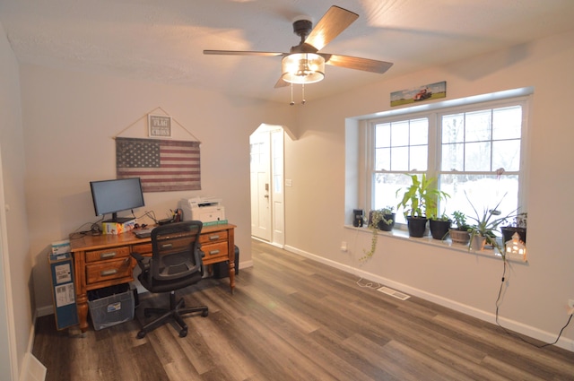 office space with ceiling fan and dark hardwood / wood-style floors