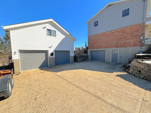 view of property exterior with a garage