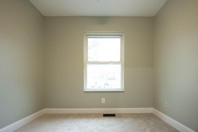 unfurnished room with carpet floors