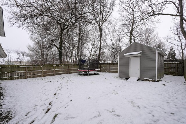 3408 Cowie Ave, Erlanger, KY 41018 - yard covered in snow with a trampoline and a storage unit