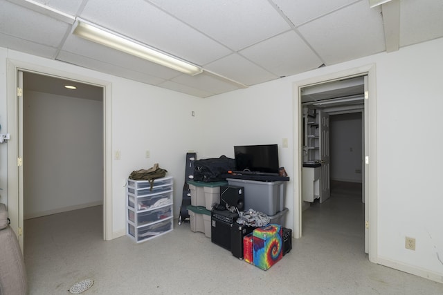 basement featuring a paneled ceiling