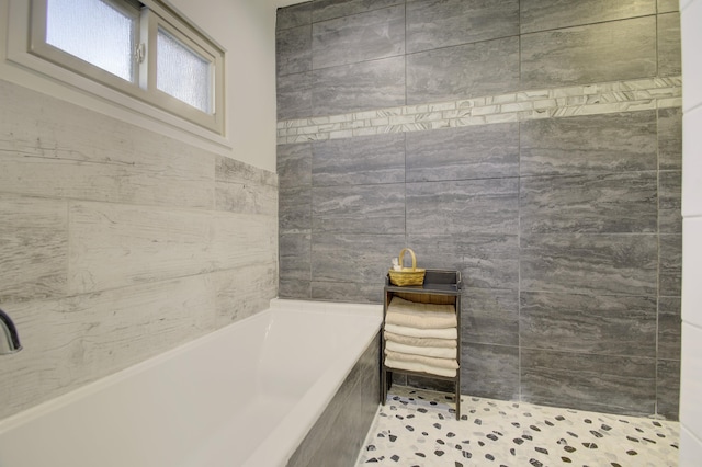 bathroom with tiled bath