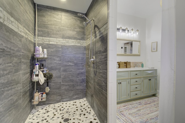 bathroom featuring vanity and a tile shower