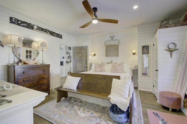 bedroom with ceiling fan and dark hardwood / wood-style flooring