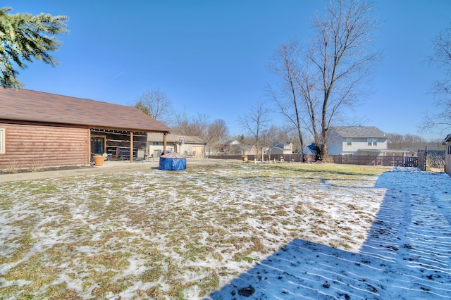 view of yard covered in snow