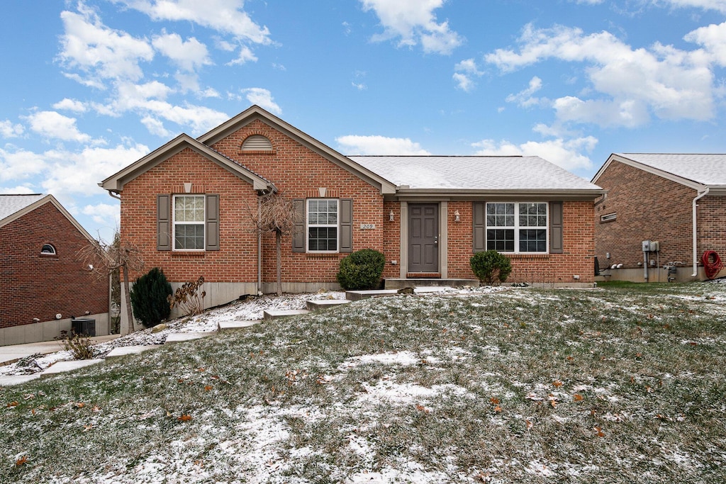 ranch-style home with a lawn