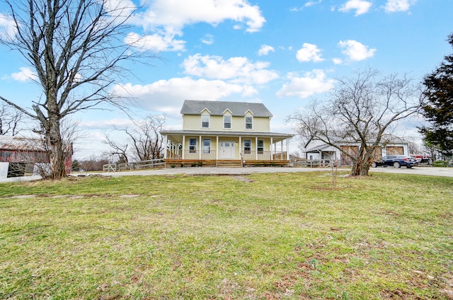 farmhouse inspired home featuring a porch and a front yard