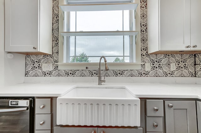 kitchen with tasteful backsplash, a healthy amount of sunlight, and dishwasher