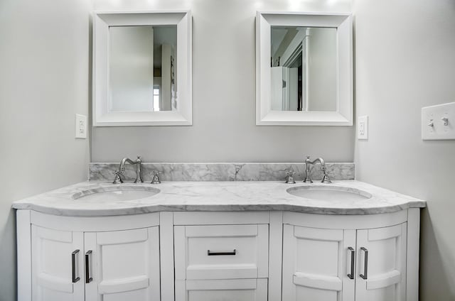 bathroom with double vanity and a sink