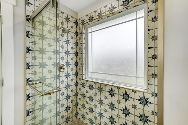 bathroom with a shower stall