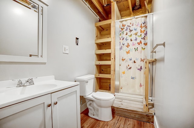 full bathroom with toilet, a shower with curtain, wood finished floors, and vanity