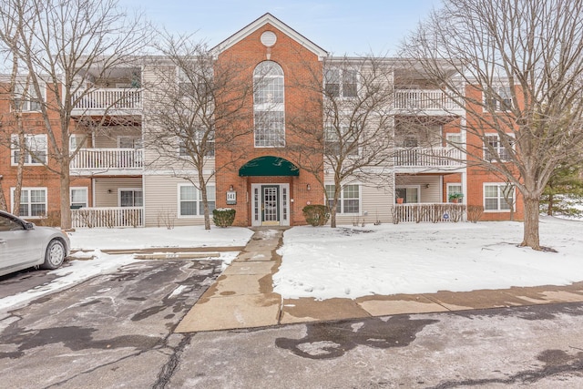 townhome / multi-family property featuring brick siding