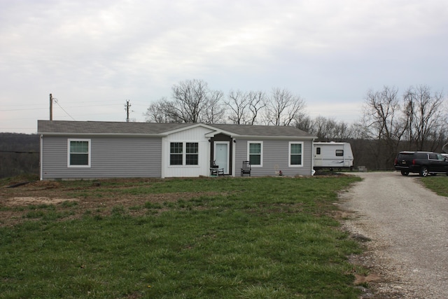 9520 E Bend Rd, Burlington, KY 41005 - manufactured / mobile home with roof with shingles, a front yard, and gravel driveway