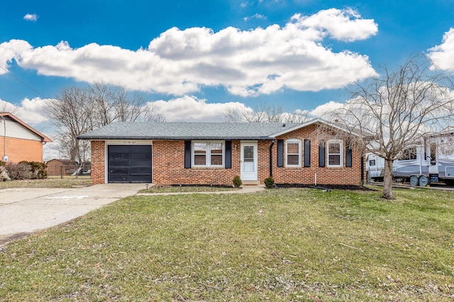 ranch-style home featuring driveway, brick siding, an attached garage, and a front yard