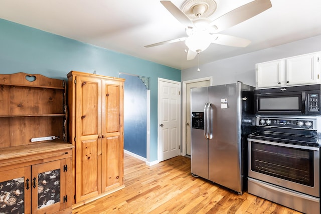 kitchen featuring white cabinetry, a ceiling fan, baseboards, appliances with stainless steel finishes, and light wood-type flooring