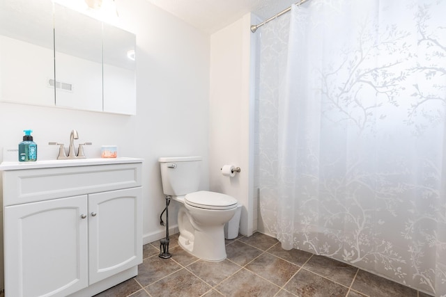 bathroom with a shower with shower curtain, tile patterned flooring, vanity, and toilet