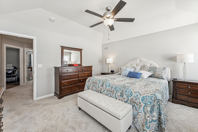 bedroom featuring lofted ceiling, ceiling fan, and light colored carpet