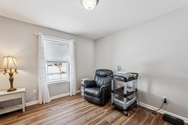 sitting room featuring hardwood / wood-style floors