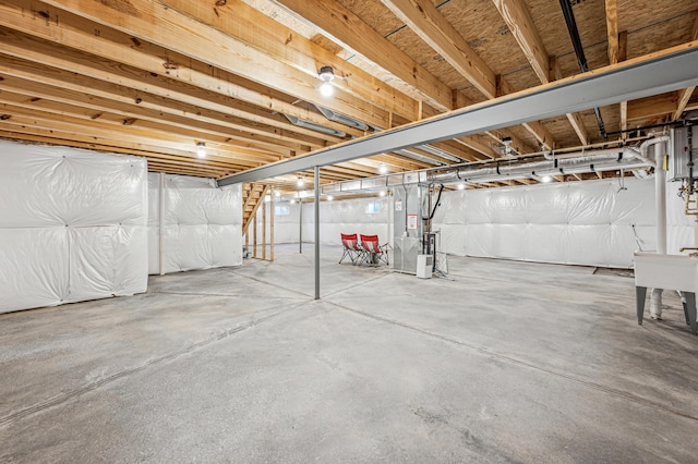 basement featuring heating unit