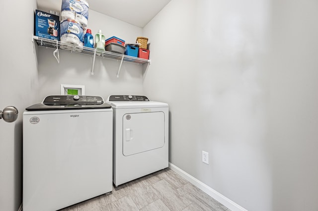 clothes washing area featuring washing machine and dryer