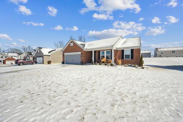 ranch-style house featuring a garage