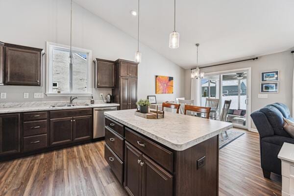 kitchen with a center island, dark brown cabinetry, decorative light fixtures, sink, and dishwasher