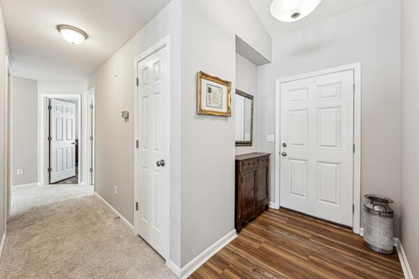 corridor with wood-type flooring