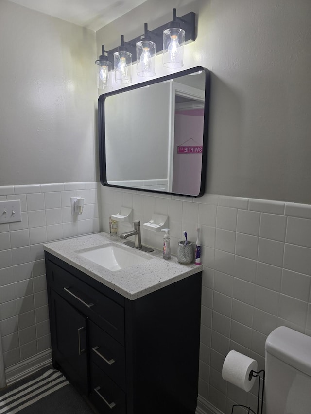 7013 Curtis Way Unit 7013, Florence, KY 41042 - bathroom with tile walls, vanity, and a wainscoted wall