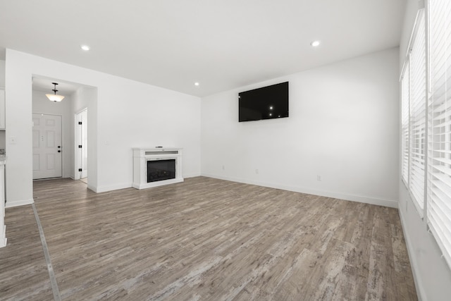 unfurnished living room featuring hardwood / wood-style floors