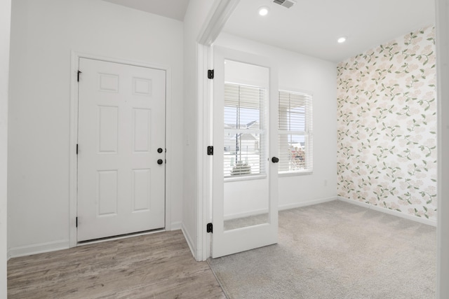 foyer with light hardwood / wood-style flooring