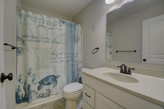 full bath with shower / bath combo, vanity, and toilet