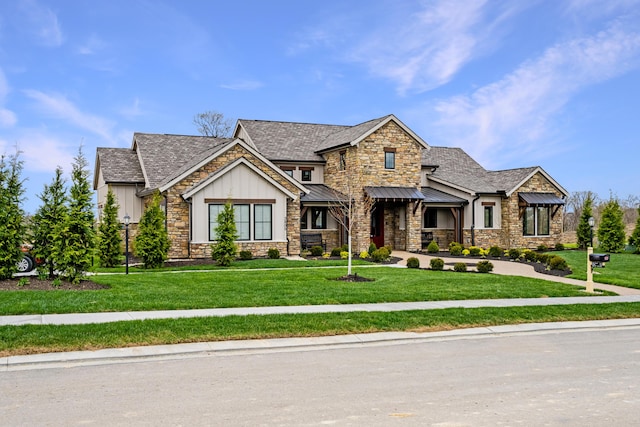 view of front of home with metal roof, a front lawn, a standing seam roof, and board and batten siding