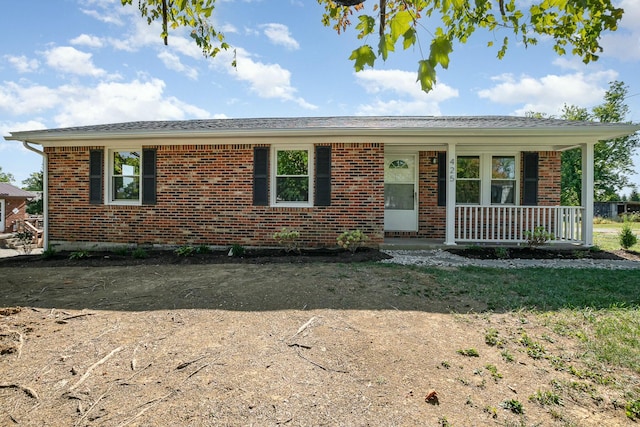 ranch-style home with covered porch and brick siding