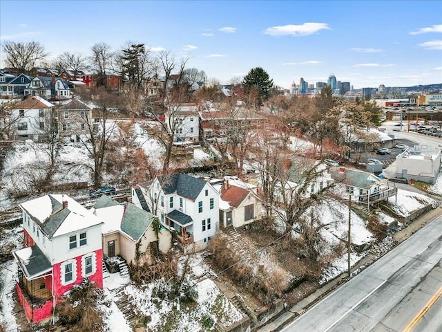 snowy aerial view with a view of city and a residential view