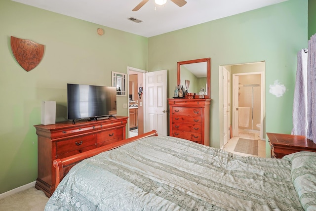 bedroom featuring light colored carpet, visible vents, connected bathroom, ceiling fan, and baseboards