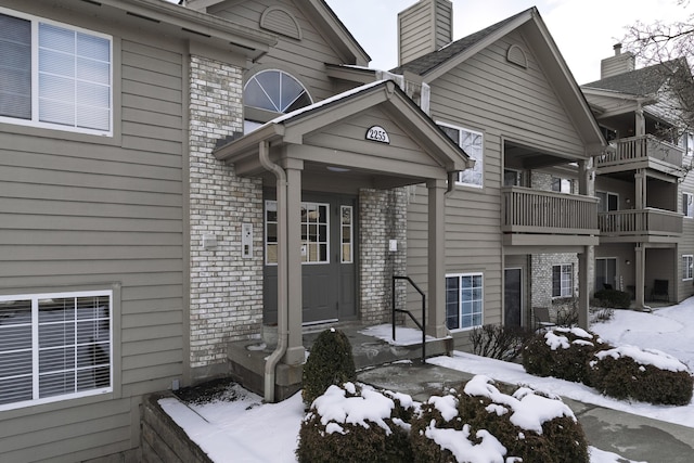 exterior space featuring brick siding