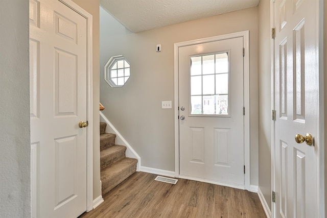 2041 Lafitte Ct, Union, KY 41091 - doorway with plenty of natural light, visible vents, and wood finished floors