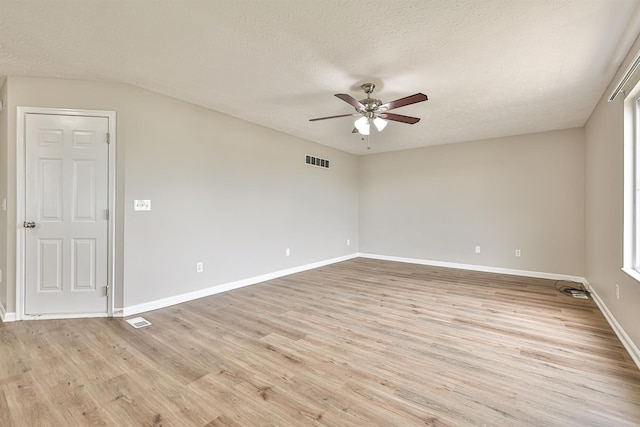 2041 Lafitte Ct, Union, KY 41091 - unfurnished room with light wood-style flooring, a textured ceiling, a ceiling fan, and visible vents