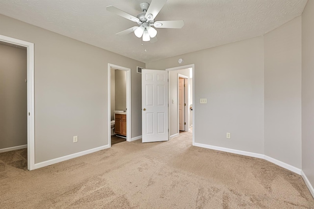 2041 Lafitte Ct, Union, KY 41091 - unfurnished bedroom featuring ensuite bath, ceiling fan, carpet flooring, a walk in closet, and baseboards