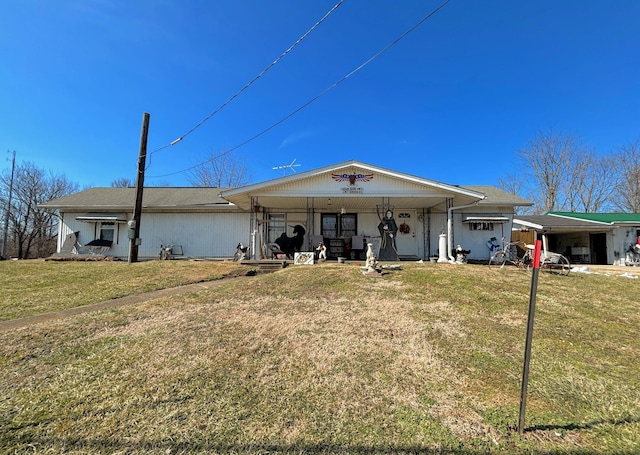 view of front of home with a front lawn and a porch