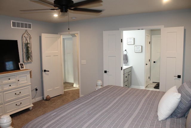 bedroom featuring ceiling fan, connected bathroom, light colored carpet, visible vents, and baseboards